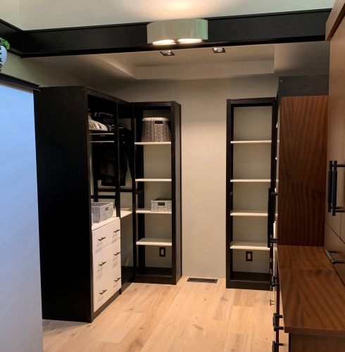 A 55-inch solid wood reach-in closet system
